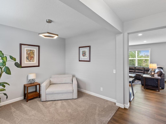 7121 208th St N, Forest Lake, MN 55025 - sitting room with wood finished floors, a textured ceiling, and recessed lighting