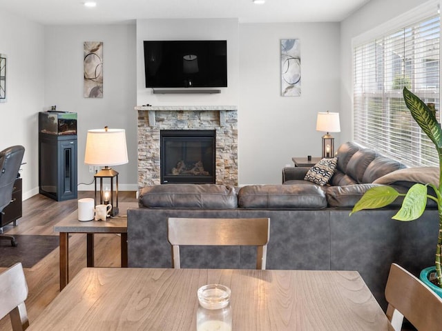 7121 208th St N, Forest Lake, MN 55025 - living area with wood finished floors, recessed lighting, and a stone fireplace