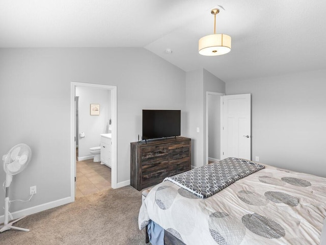 7121 208th St N, Forest Lake, MN 55025 - bedroom featuring vaulted ceiling, light colored carpet, connected bathroom, and light tile patterned floors