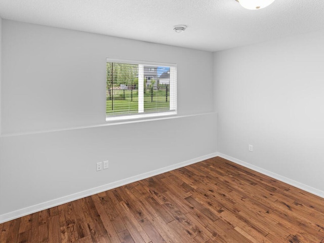 7121 208th St N, Forest Lake, MN 55025 - unfurnished room with dark wood-type flooring and a smoke detector