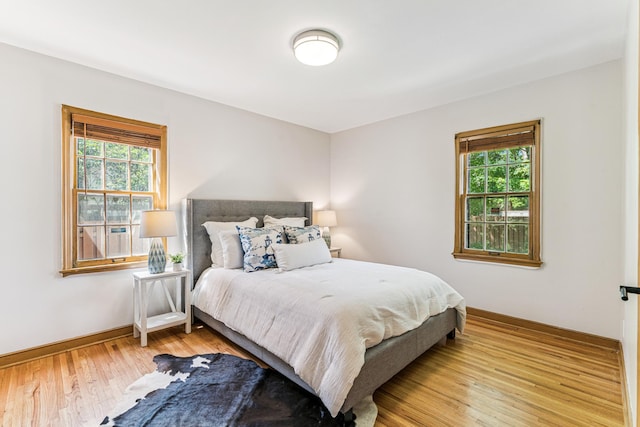 5640 13th Ave S, Minneapolis, MN 55417 - bedroom with multiple windows and wood finished floors