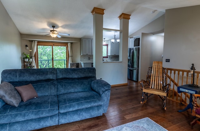 2053 45th St SE, Saint Cloud, MN 56304 - living area with dark wood finished floors, ceiling fan, lofted ceiling, baseboards, and a chandelier