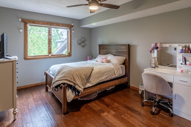 2053 45th St SE, Saint Cloud, MN 56304 - bedroom featuring dark wood-style flooring, baseboards, a ceiling fan, and an office area