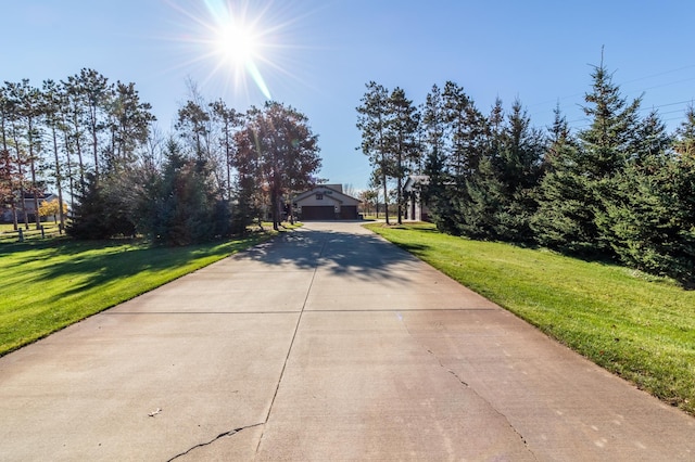 2053 45th St SE, Saint Cloud, MN 56304 - obstructed view of property with driveway and a front yard