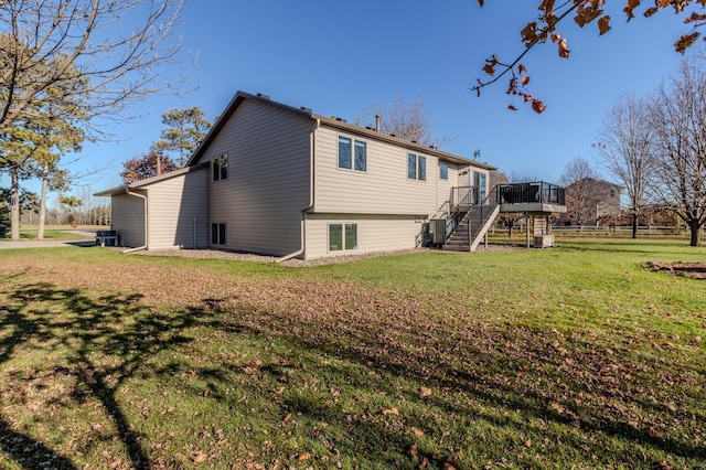 2053 45th St SE, Saint Cloud, MN 56304 - back of property with stairs, a deck, and a yard