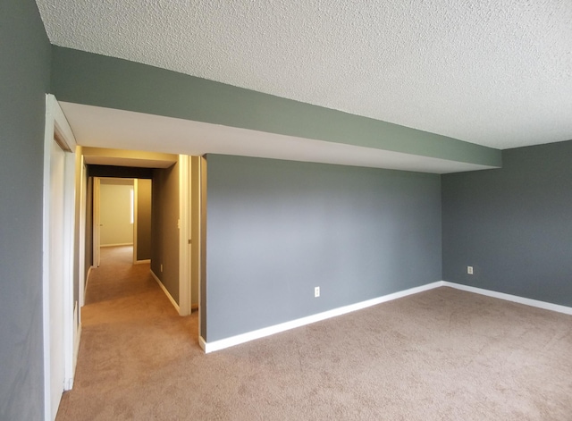 732 Vernon Ave NW, Elk River, MN 55330 - empty room featuring carpet, a textured ceiling, and baseboards
