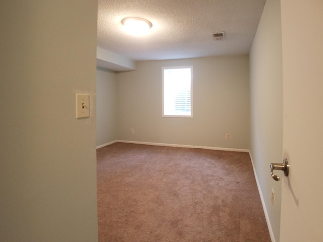732 Vernon Ave NW, Elk River, MN 55330 - empty room with a textured ceiling, carpet floors, and baseboards