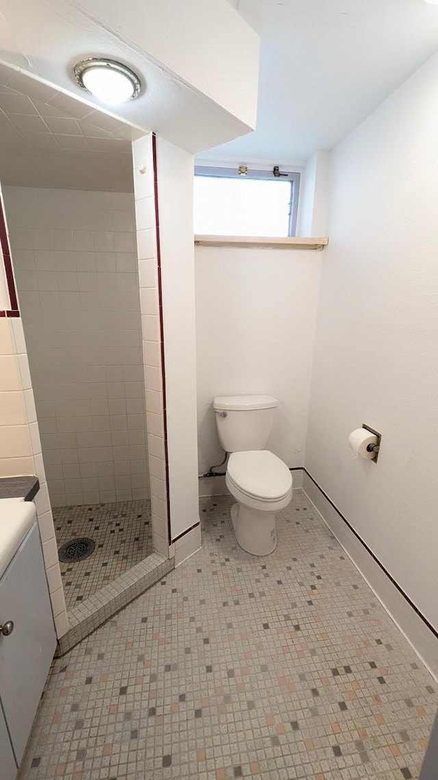4825 Drew Ave S, Minneapolis, MN 55410 - full bath with a stall shower, toilet, and baseboards