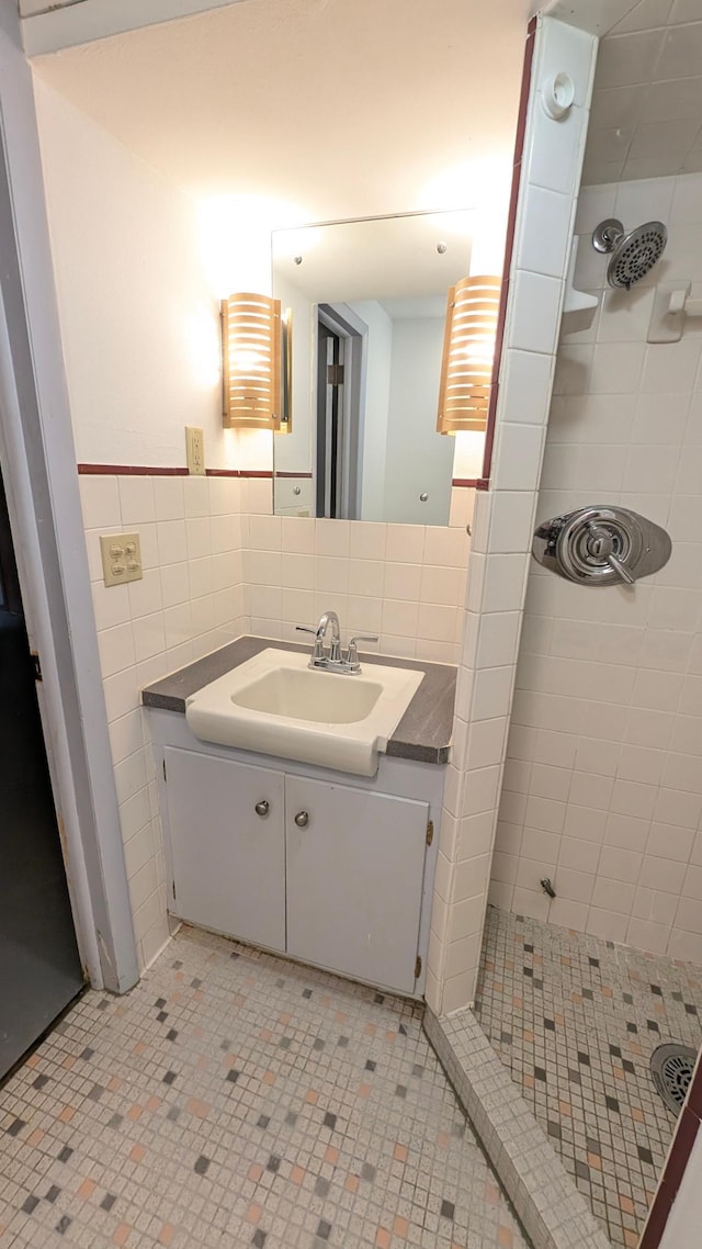 4825 Drew Ave S, Minneapolis, MN 55410 - full bathroom with a stall shower, tile walls, and vanity