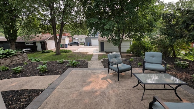 4825 Drew Ave S, Minneapolis, MN 55410 - view of patio featuring an attached garage and an outdoor structure