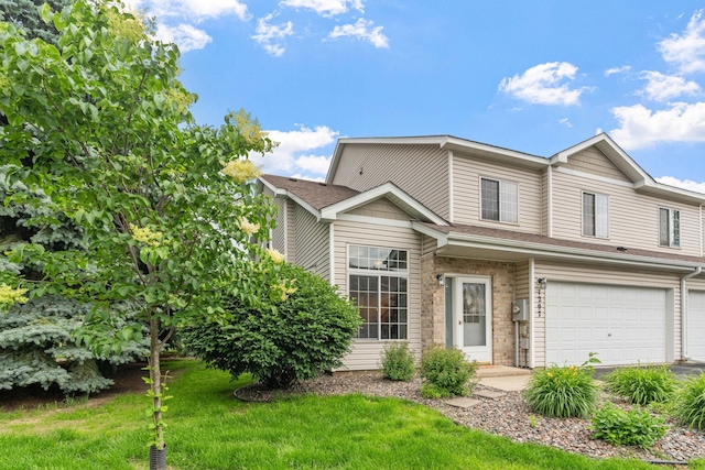 1297 124th Ave NE, Blaine, MN 55434 - view of front of home featuring an attached garage and a front lawn