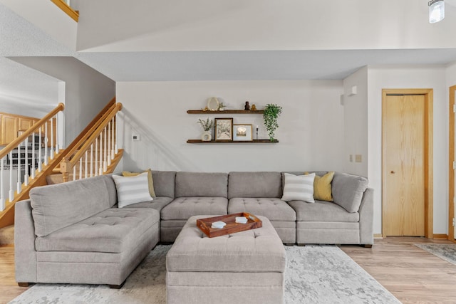 1297 124th Ave NE, Blaine, MN 55434 - living room with light wood-style floors and stairway