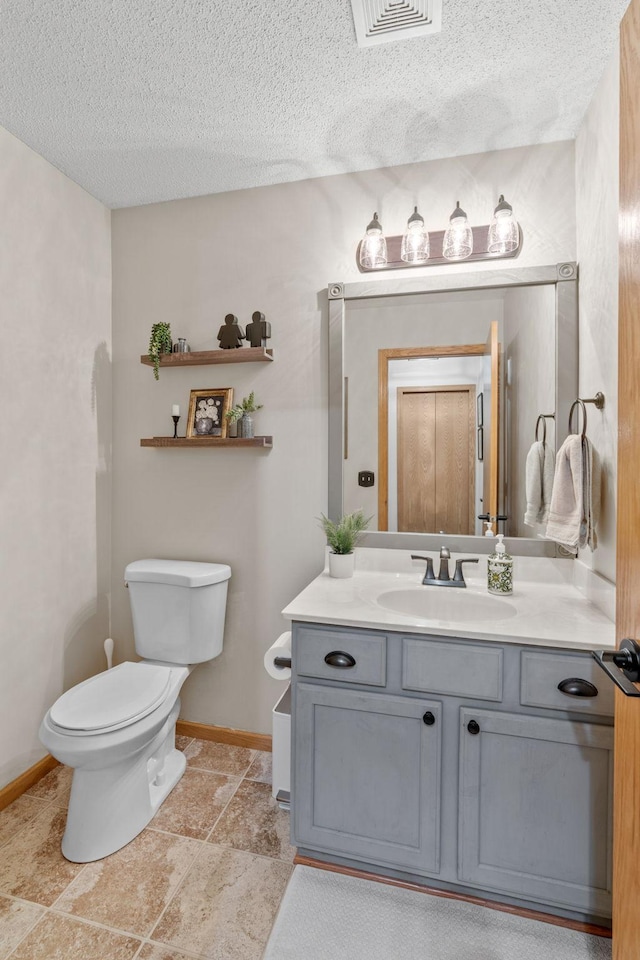 1297 124th Ave NE, Blaine, MN 55434 - bathroom featuring vanity and a textured ceiling