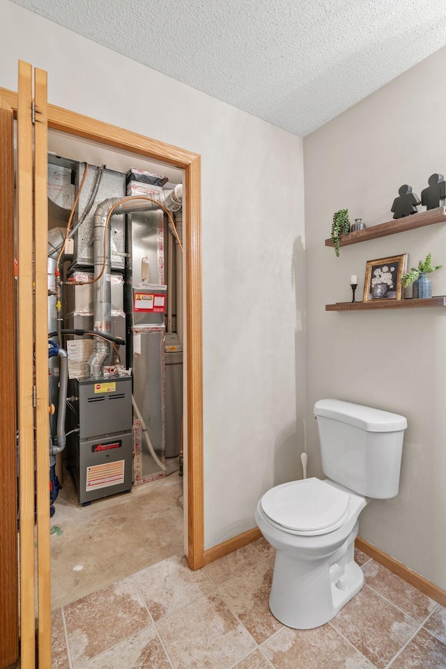 1297 124th Ave NE, Blaine, MN 55434 - half bathroom featuring a textured ceiling and heating unit