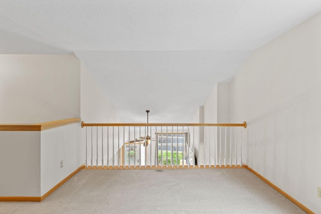 1297 124th Ave NE, Blaine, MN 55434 - unfurnished room featuring carpet flooring and lofted ceiling