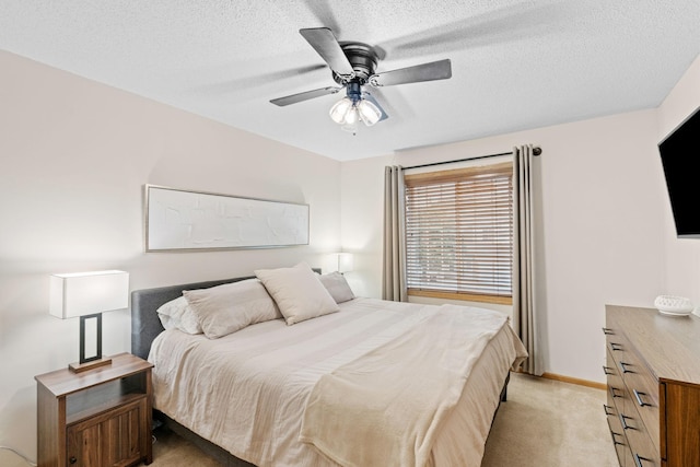1297 124th Ave NE, Blaine, MN 55434 - bedroom featuring light colored carpet, a textured ceiling, and ceiling fan