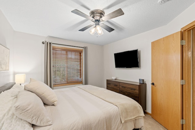 1297 124th Ave NE, Blaine, MN 55434 - bedroom featuring light carpet and ceiling fan