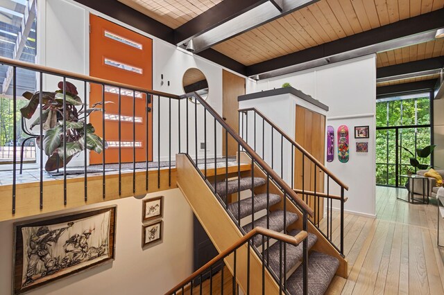 18101 Woolman Dr, Minnetonka, MN 55345 - stairway featuring hardwood / wood-style flooring, plenty of natural light, and wooden ceiling with exposed beams