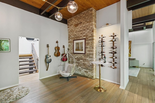 18101 Woolman Dr, Minnetonka, MN 55345 - wine cellar with wood ceiling with exposed beams, hardwood / wood-style flooring, and baseboards