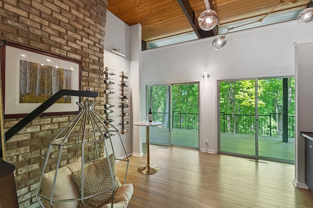 18101 Woolman Dr, Minnetonka, MN 55345 - corridor with plenty of natural light, wooden ceiling, hardwood / wood-style flooring, and a high ceiling