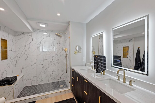 18101 Woolman Dr, Minnetonka, MN 55345 - bathroom featuring double vanity, a marble finish shower, and recessed lighting