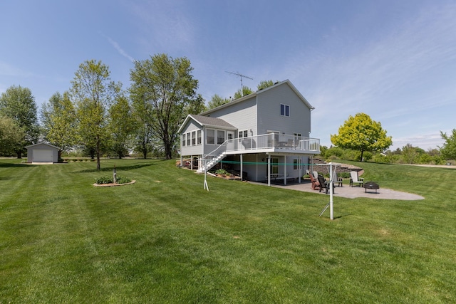 176 Westchester Dr NW, Rochester, MN 55901 - rear view of house featuring a fire pit, a deck, a yard, stairway, and a patio area