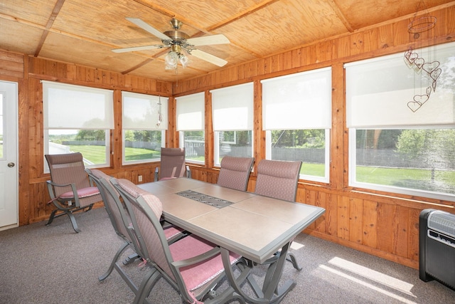 176 Westchester Dr NW, Rochester, MN 55901 - sunroom / solarium with wood walls, ceiling fan, wooden ceiling, carpet flooring, and heating unit