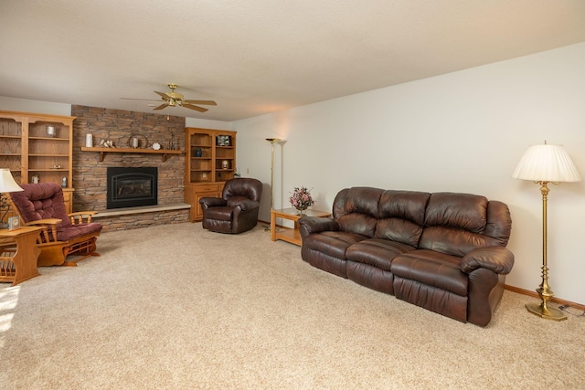 176 Westchester Dr NW, Rochester, MN 55901 - carpeted living room featuring a ceiling fan and a stone fireplace