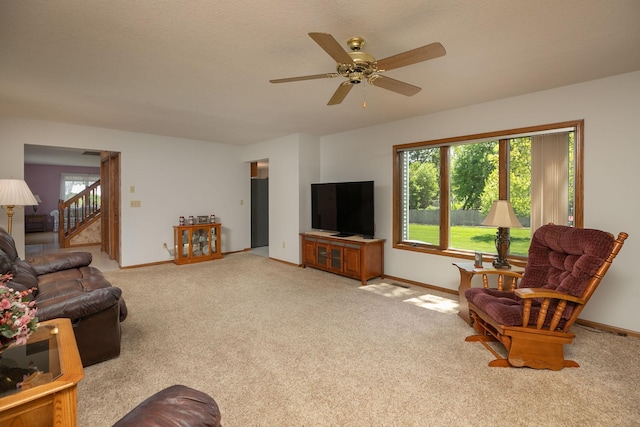 176 Westchester Dr NW, Rochester, MN 55901 - carpeted living room with baseboards and ceiling fan