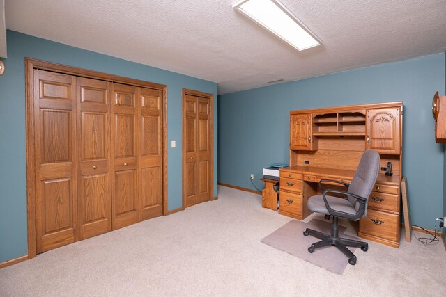 176 Westchester Dr NW, Rochester, MN 55901 - home office featuring light carpet, a textured ceiling, and baseboards