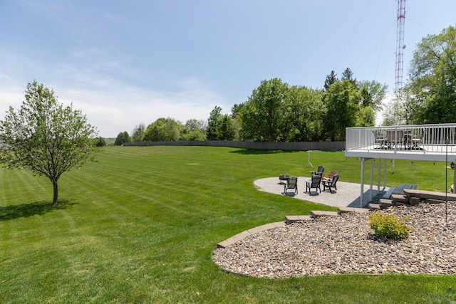 176 Westchester Dr NW, Rochester, MN 55901 - view of yard featuring an outdoor fire pit, a deck, and a patio area