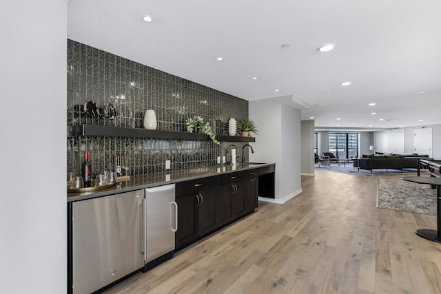20 2nd St NE Unit P1008, Minneapolis, MN 55413 - indoor wet bar featuring fridge, backsplash, recessed lighting, and light wood finished floors