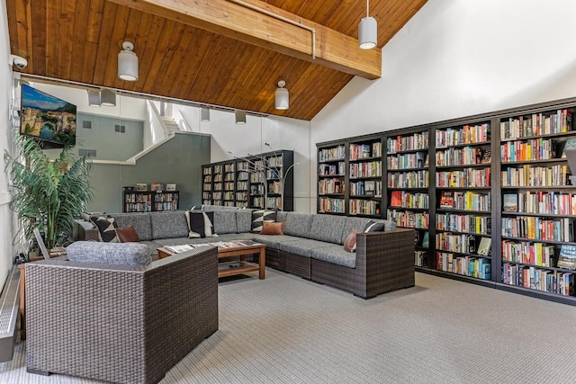 20 2nd St NE Unit P1008, Minneapolis, MN 55413 - living area featuring wall of books, carpet flooring, wood ceiling with exposed beams, and high vaulted ceiling