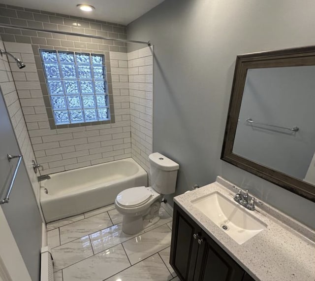 1733 37th Ave NE, Columbia Heights, MN 55421 - bathroom featuring shower / tub combination, toilet, vanity, marble finish floors, and baseboard heating
