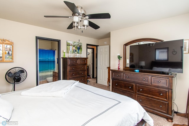 4110 Clubhouse Dr S, Fargo, ND 58104 - bedroom with light colored carpet, ensuite bathroom, and a ceiling fan
