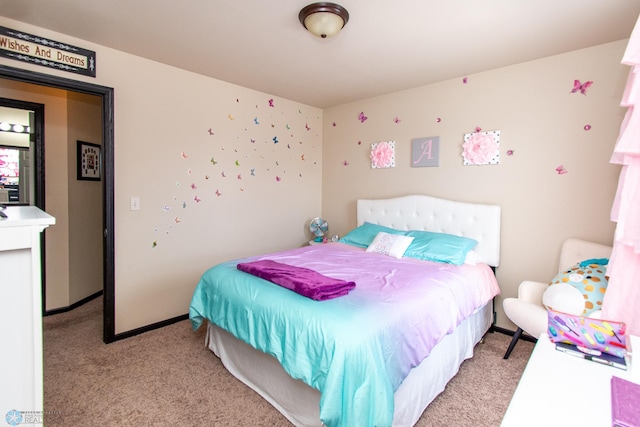 4110 Clubhouse Dr S, Fargo, ND 58104 - bedroom featuring light carpet and baseboards