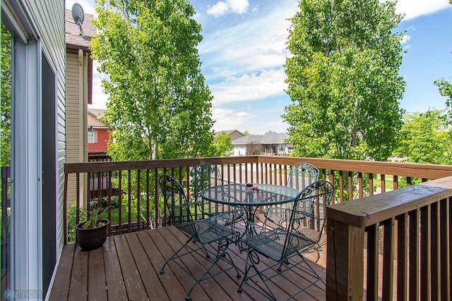 4110 Clubhouse Dr S, Fargo, ND 58104 - deck with outdoor dining area and a residential view