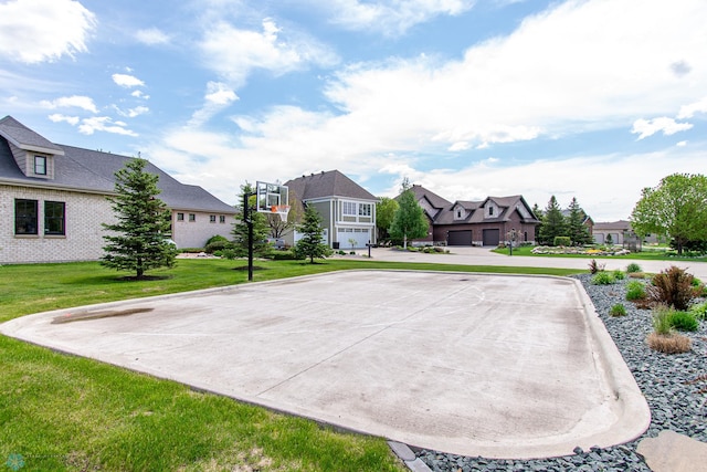 4110 Clubhouse Dr S, Fargo, ND 58104 - view of sport court with a residential view and a yard