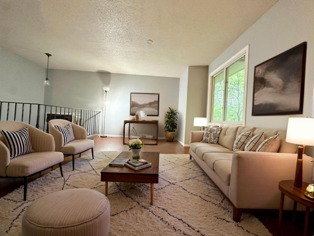 9329 Bass Creek Cir N, New Hope, MN 55428 - living area with baseboards, a textured ceiling, and wood finished floors
