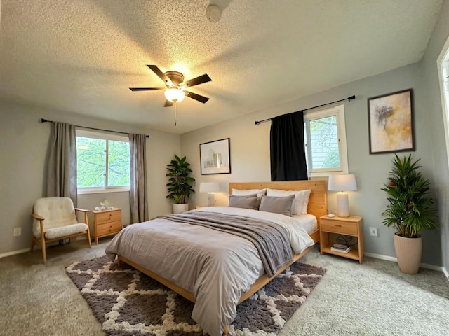 9329 Bass Creek Cir N, New Hope, MN 55428 - bedroom featuring light carpet, a textured ceiling, baseboards, and a ceiling fan