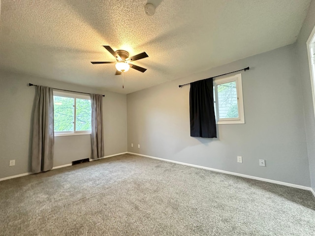 9329 Bass Creek Cir N, New Hope, MN 55428 - carpeted empty room with a textured ceiling, a ceiling fan, and baseboards