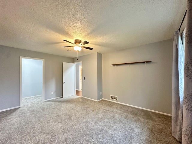 9329 Bass Creek Cir N, New Hope, MN 55428 - unfurnished room featuring a textured ceiling, a ceiling fan, carpet flooring, and baseboards