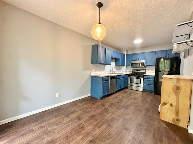 9329 Bass Creek Cir N, New Hope, MN 55428 - kitchen with appliances with stainless steel finishes, a sink, blue cabinets, light countertops, and a textured ceiling