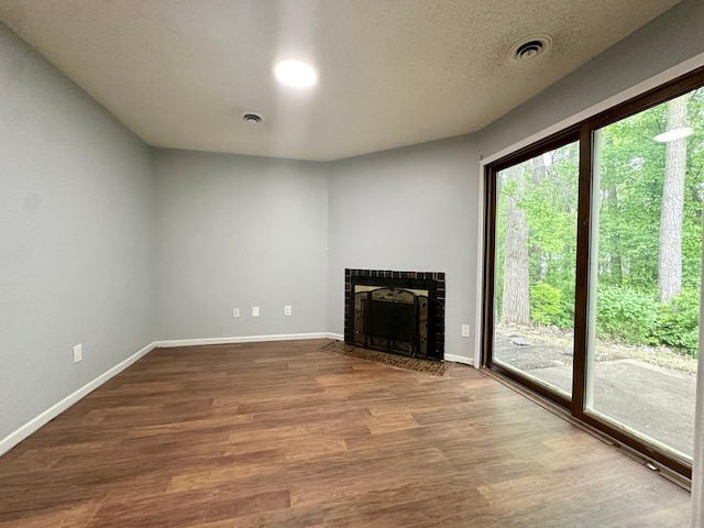 9329 Bass Creek Cir N, New Hope, MN 55428 - unfurnished living room featuring a fireplace, wood finished floors, and baseboards