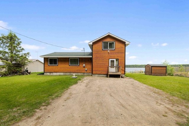 2648 Lake Shore Dr, Scandia Valley Twp, MN 56466 - back of property featuring dirt driveway, a yard, log veneer siding, and a shingled roof