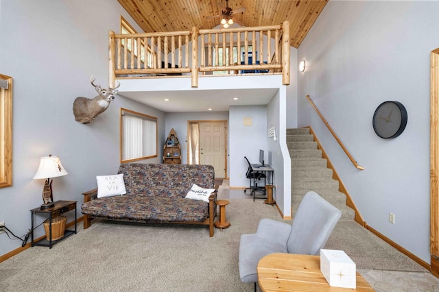 2648 Lake Shore Dr, Scandia Valley Twp, MN 56466 - carpeted living area with wooden ceiling, a ceiling fan, stairs, baseboards, and high vaulted ceiling