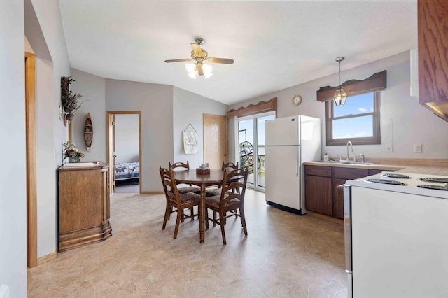 2648 Lake Shore Dr, Scandia Valley Twp, MN 56466 - dining area with ceiling fan, baseboards, and lofted ceiling