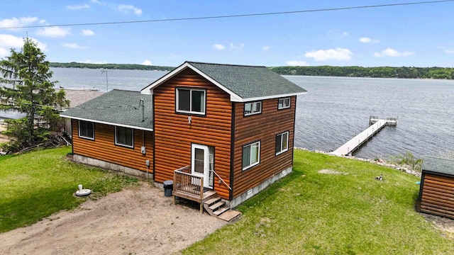 2648 Lake Shore Dr, Scandia Valley Twp, MN 56466 - view of home's exterior with roof with shingles, a water view, a lawn, and faux log siding