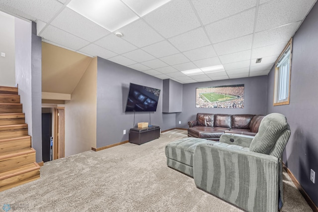 805 7th St NE, Dilworth, MN 56529 - carpeted living area with a paneled ceiling, stairway, baseboards, and healthy amount of natural light