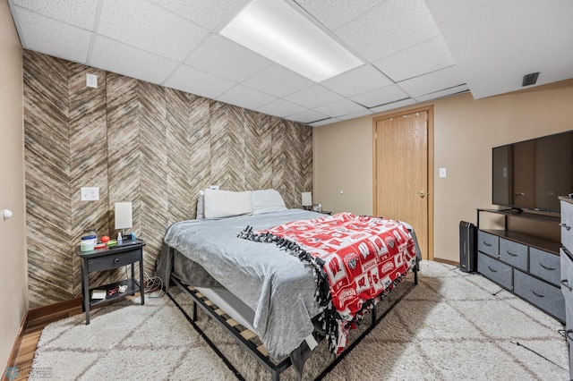 805 7th St NE, Dilworth, MN 56529 - bedroom with a drop ceiling, baseboards, and an accent wall